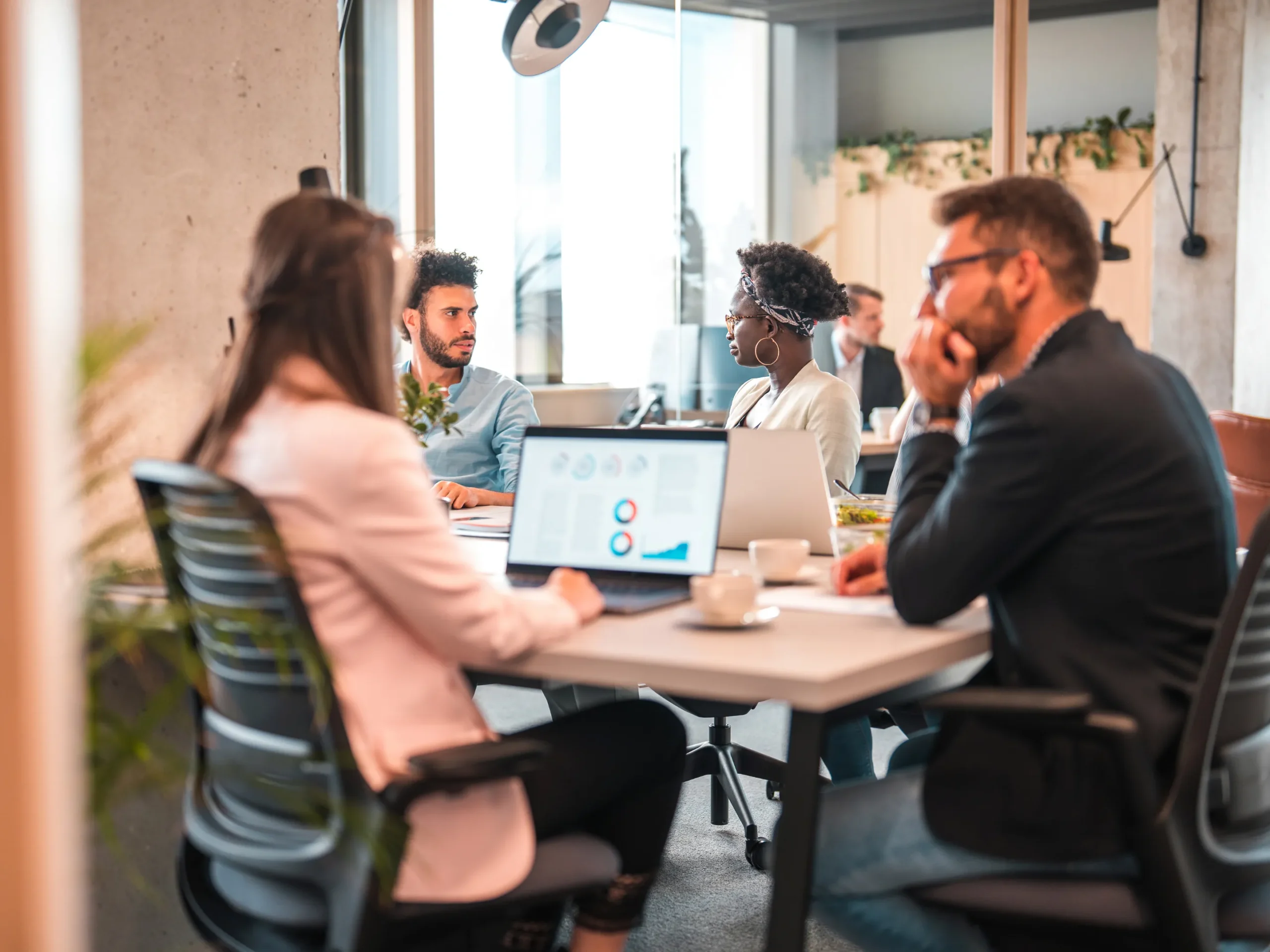 people meeting in an office over a media strategy