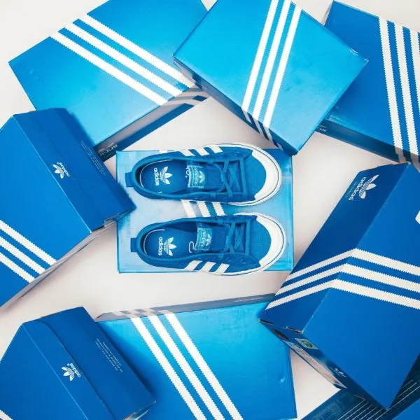 Adidas brand awareness with sneaker shoes and boxes