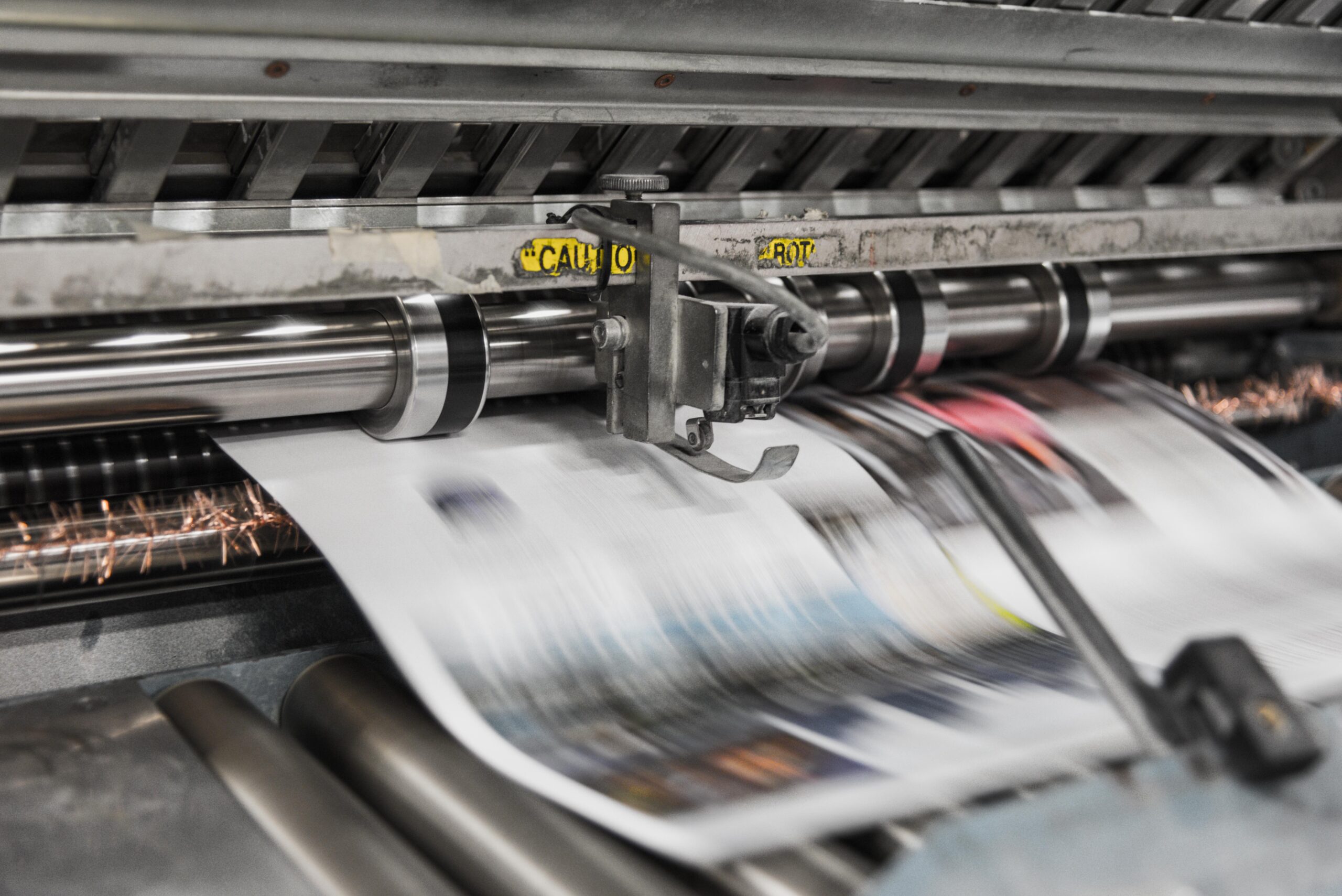 print media being printed from a machine