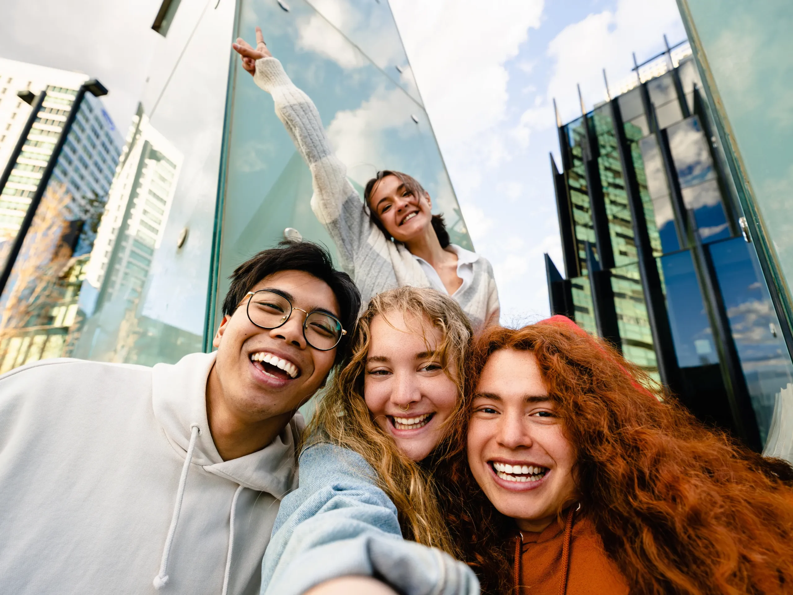 group of young adults taking a selfie