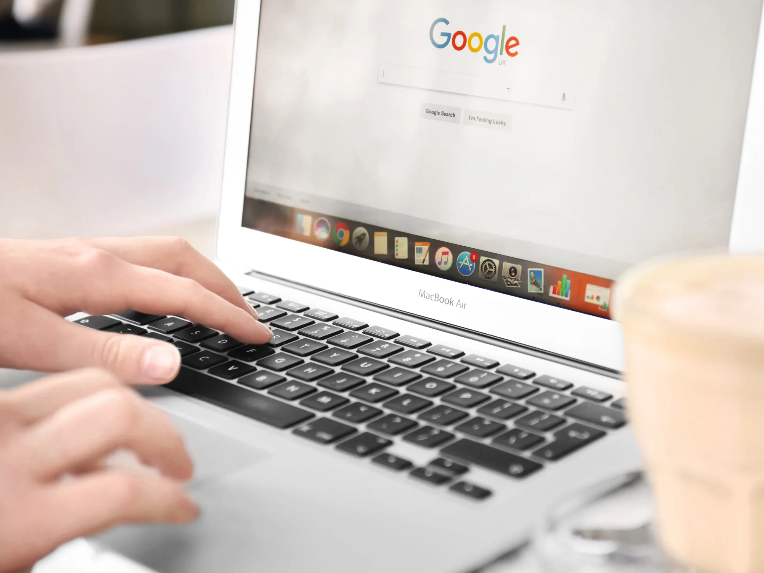 person on laptop using google search engine
