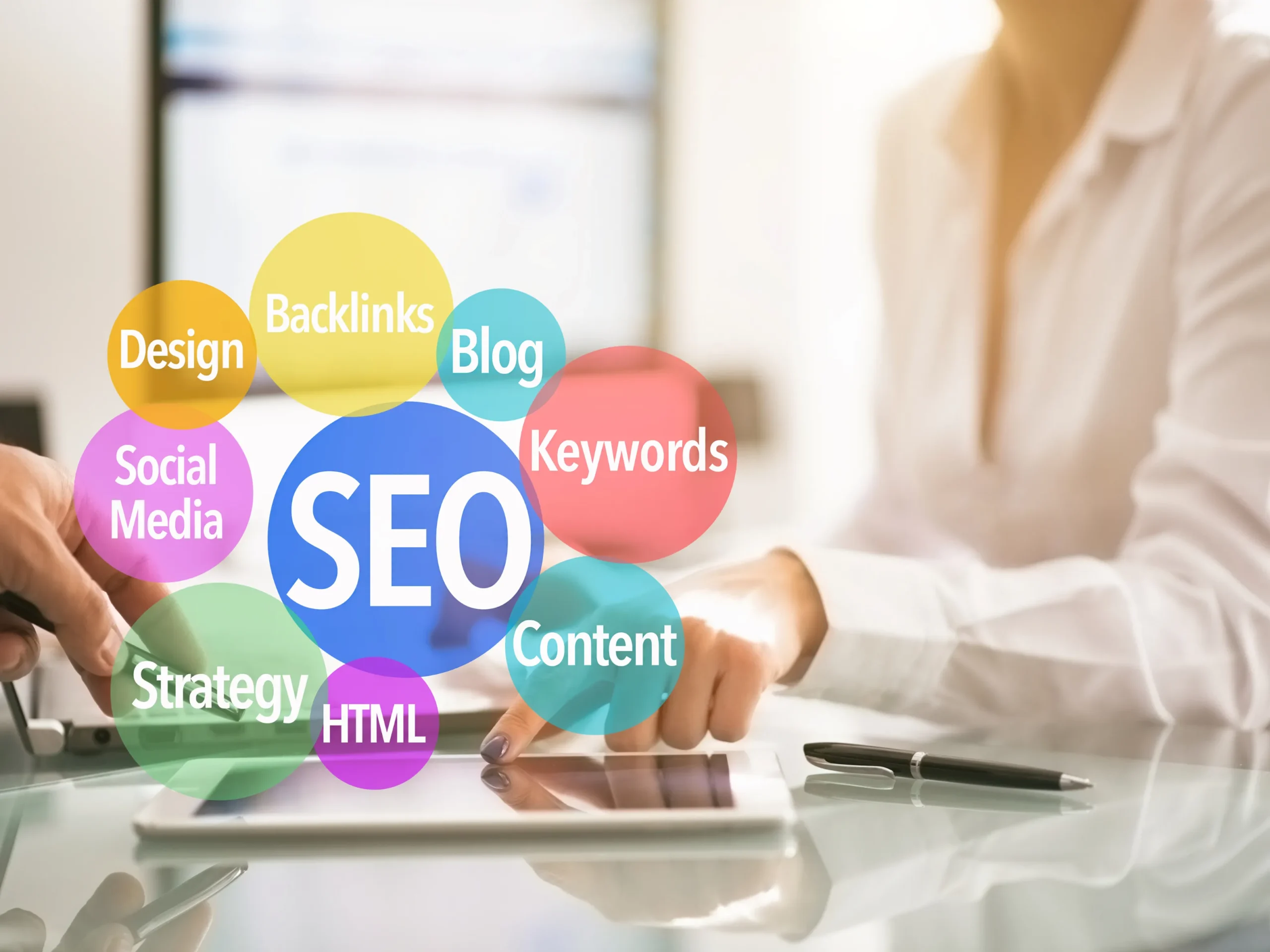 Woman pointing at tablet that is showing SEO connection